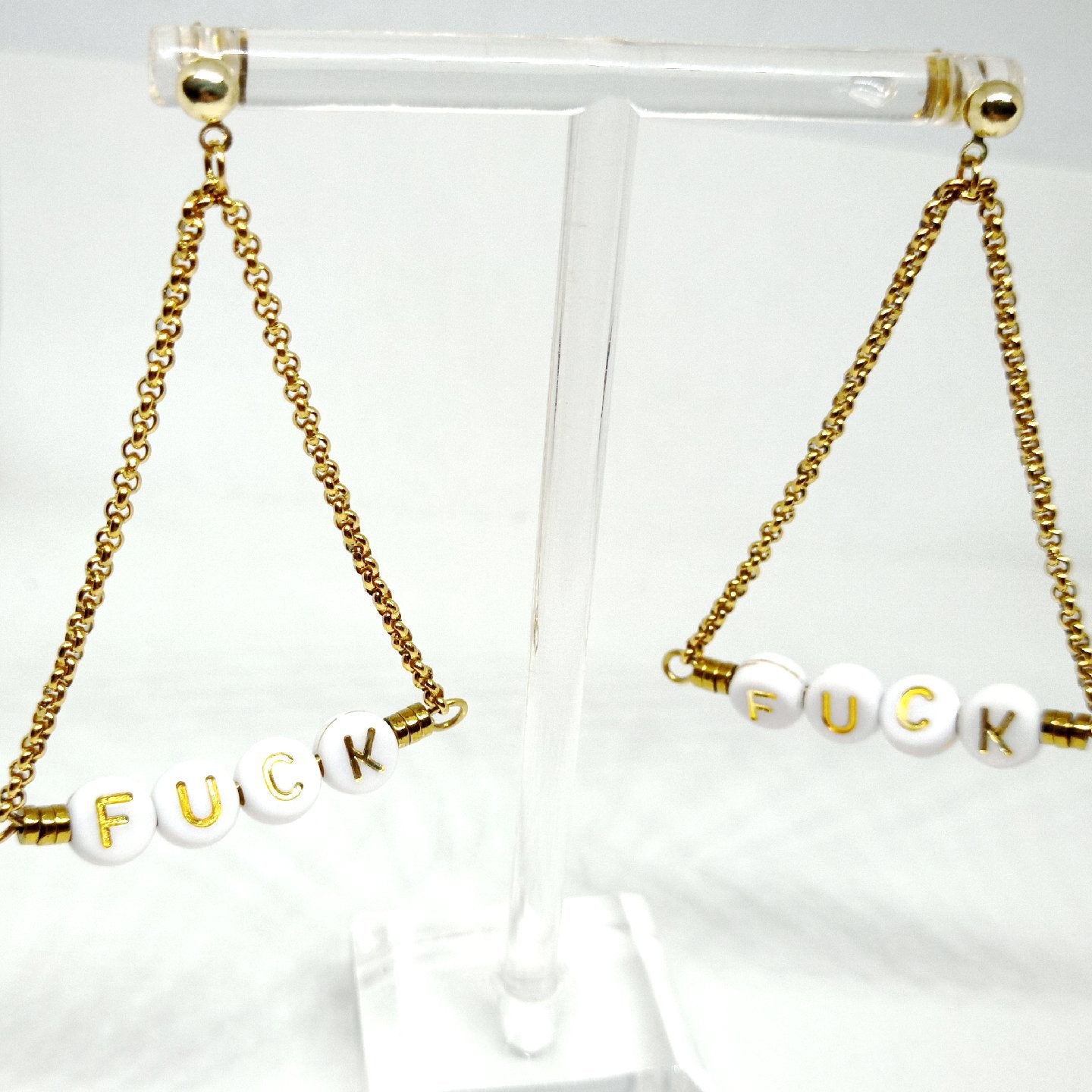 Boucles d'oreilles à message "fuck"